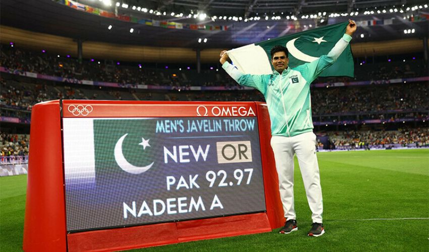 Arshad Nadeem celebrating after winning the Olympic gold medal in the men's javelin throw, showcasing Pakistan's historic athletics achievement.